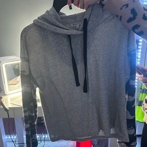 This is a grey pullover/shirt with camo sleeves size small. Can fit size 2/4